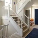 A staircase that turns at a landing halfway up